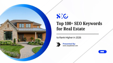 A promotional graphic titled "Top 100+ SEO Keywords for Real Estate to Rank Higher in 2026" presented by seopakistan.com. A large circular frame on the left showcases a beautiful, modern craftsman-style home with a stone and wood exterior, landscaped front yard, and a stone walkway.